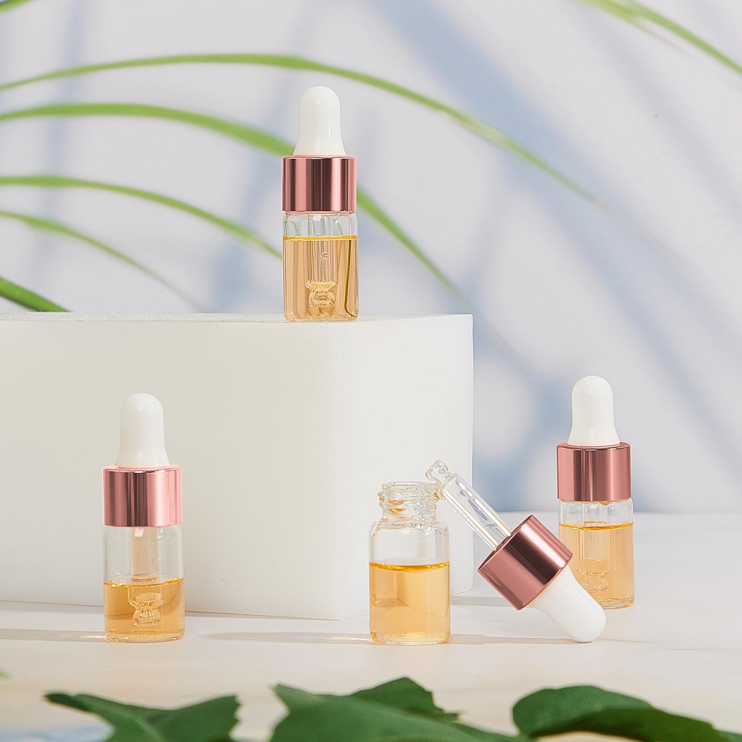 Didaey 100 Pcs Mini Glass Oil Dropper Bottle Bulk, 3 ml Rose Gold Clear Essential Small Empty Bottles Sample Containers Perfume Liquid Vials with Cap for Traveling