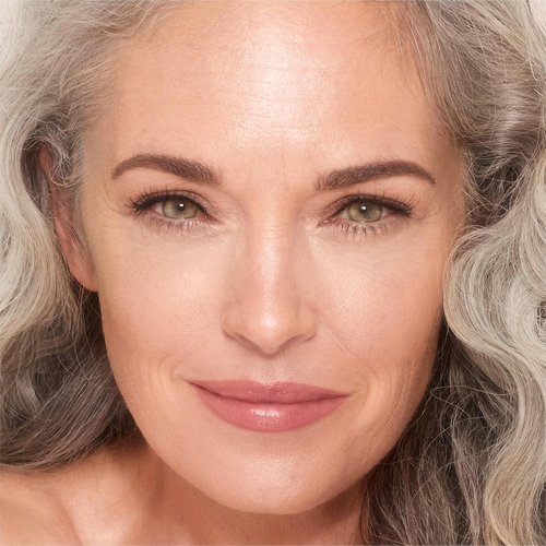 Charlotte Tilbury Unreal Skin Tint - Hydrating Cream Foundation Stick with Sheer-to-Light Coverage | Blurring & Nourishing Formula