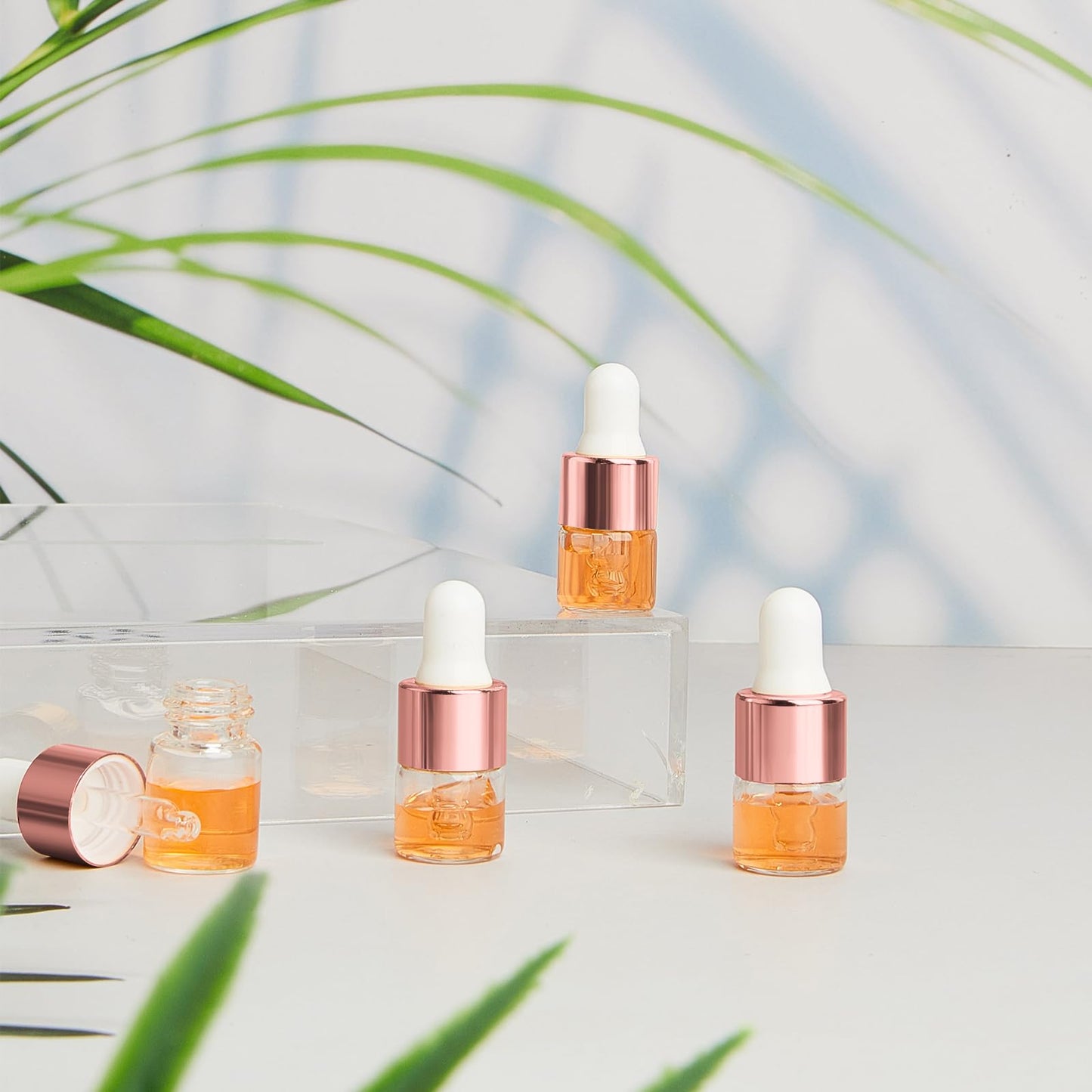 Didaey 100 Pcs Mini Glass Oil Dropper Bottle Bulk, 1 ml Rose Gold Clear Essential Small Empty Bottles Sample Containers Perfume Liquid Vials with Cap for Traveling