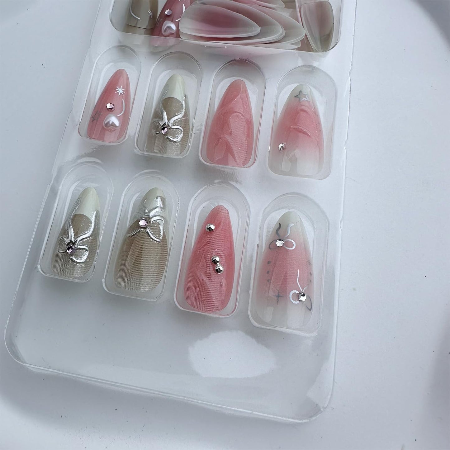 LBPEPAMZ Pink Press on Nails Medium Almond Fake Nails with 3D Silver Bow Bead Pearl Designs White Gradient French Tips Acrylic Nails False Nails Heart Full Cover Glossy Stick on Nails for Women 24Pcs
