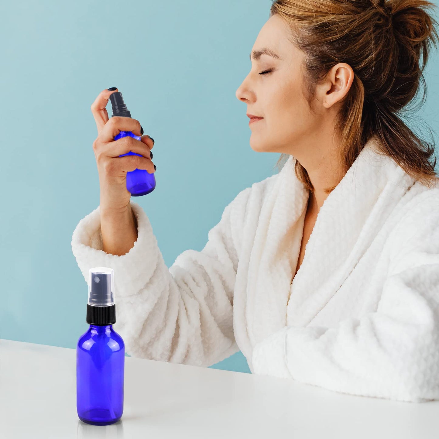 Wedama Glass Spray Bottles, Mini Spray Bottles 2 oz, Empty Small Spray Bottles with Funnel Dropper, Fine Mist for Hair, Travel, Plants, Cleaning Solutions and Skin Care (4 Pack Blue)