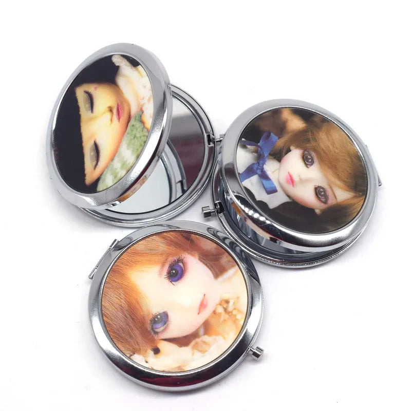 Mini Double-Sided Pocket Makeup Mirror - Cute Doll Design, Stainless Steel, Portable