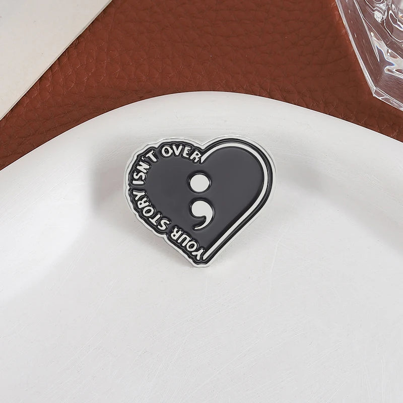 Semicolon Motivational Enamel Pin - Your Story Isn't Over Black Heart Badge