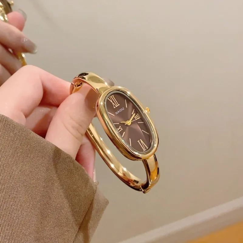 Women’s Oval Roman Dial Quartz Watch with Gold Finish and Bracelet Strap