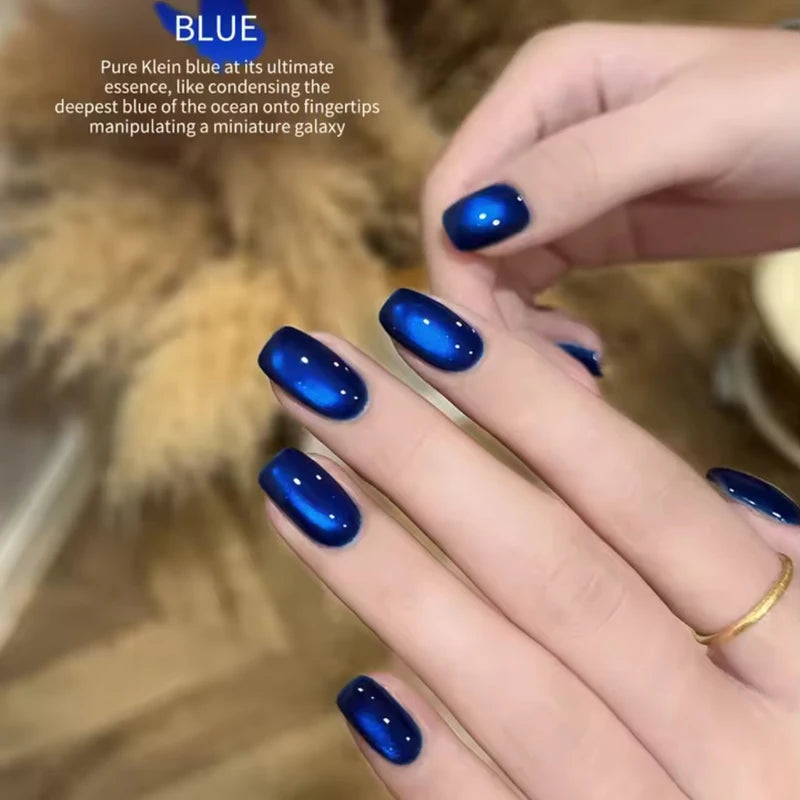 Vibrant Blue Moon Cat Eye Nail Gel with Sparkling Glass Bead Effect - Trendy Nail Art