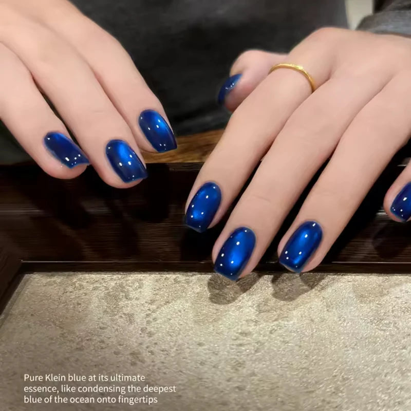Vibrant Blue Moon Cat Eye Nail Gel with Sparkling Glass Bead Effect - Trendy Nail Art