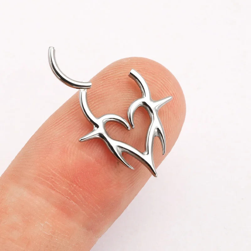 Titanium Septum Piercing Clicker with Tribal Fangs and Heart Totem Design