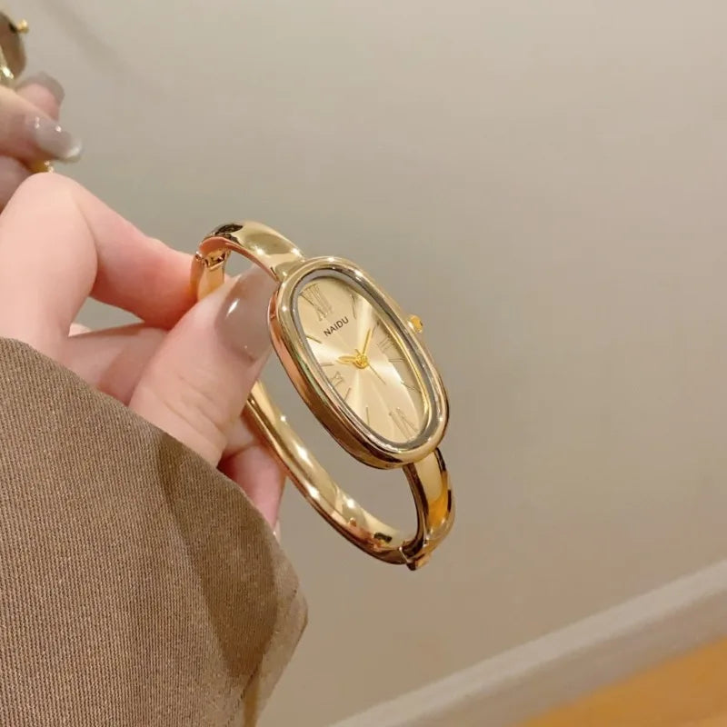 Women’s Oval Roman Dial Quartz Watch with Gold Finish and Bracelet Strap