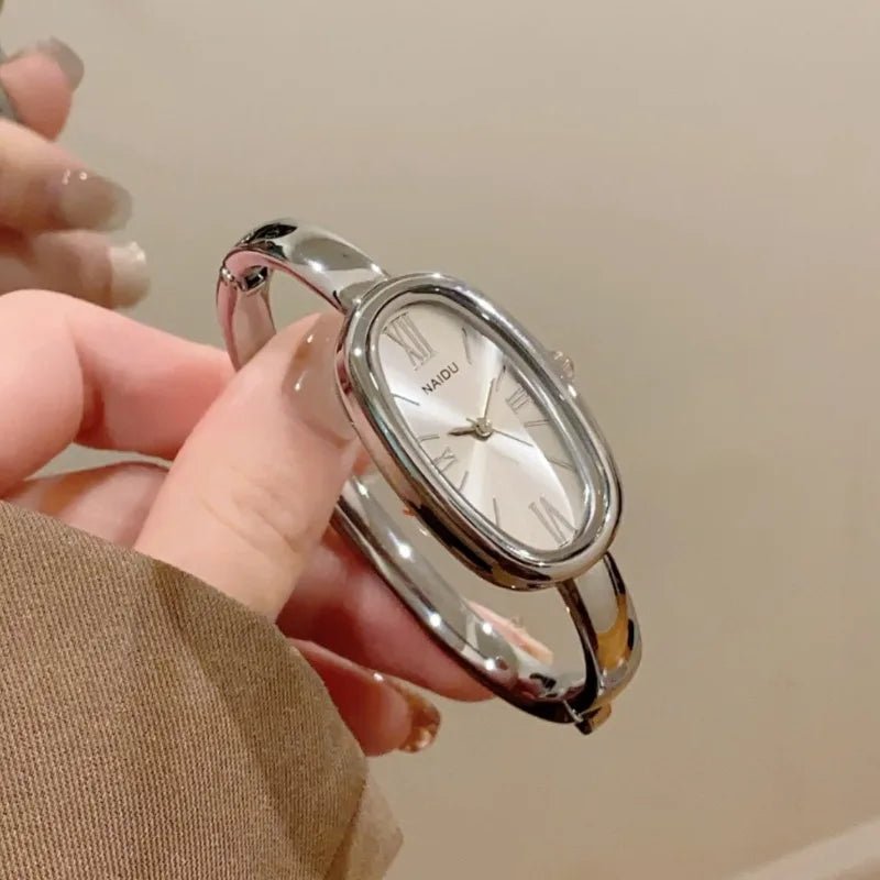 Women’s Oval Roman Dial Quartz Watch with Gold Finish and Bracelet Strap