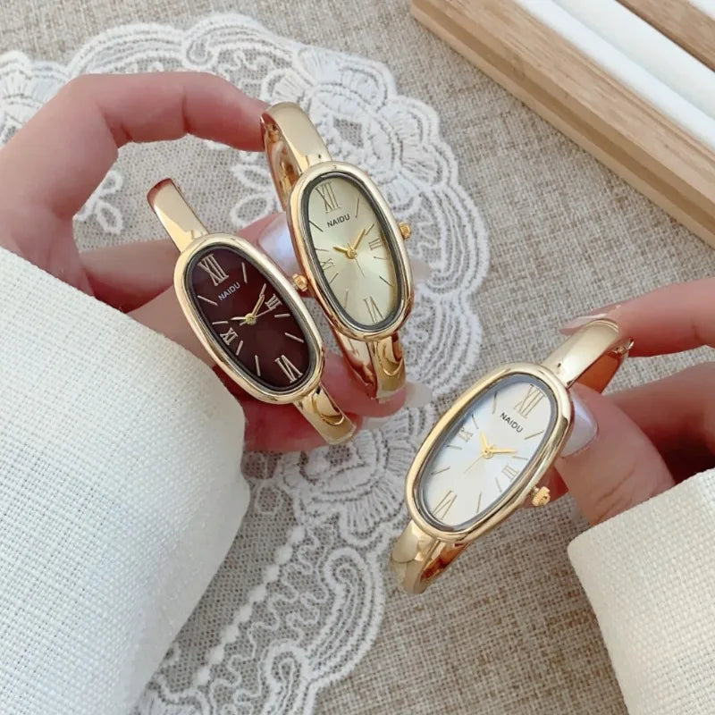 Women’s Oval Roman Dial Quartz Watch with Gold Finish and Bracelet Strap