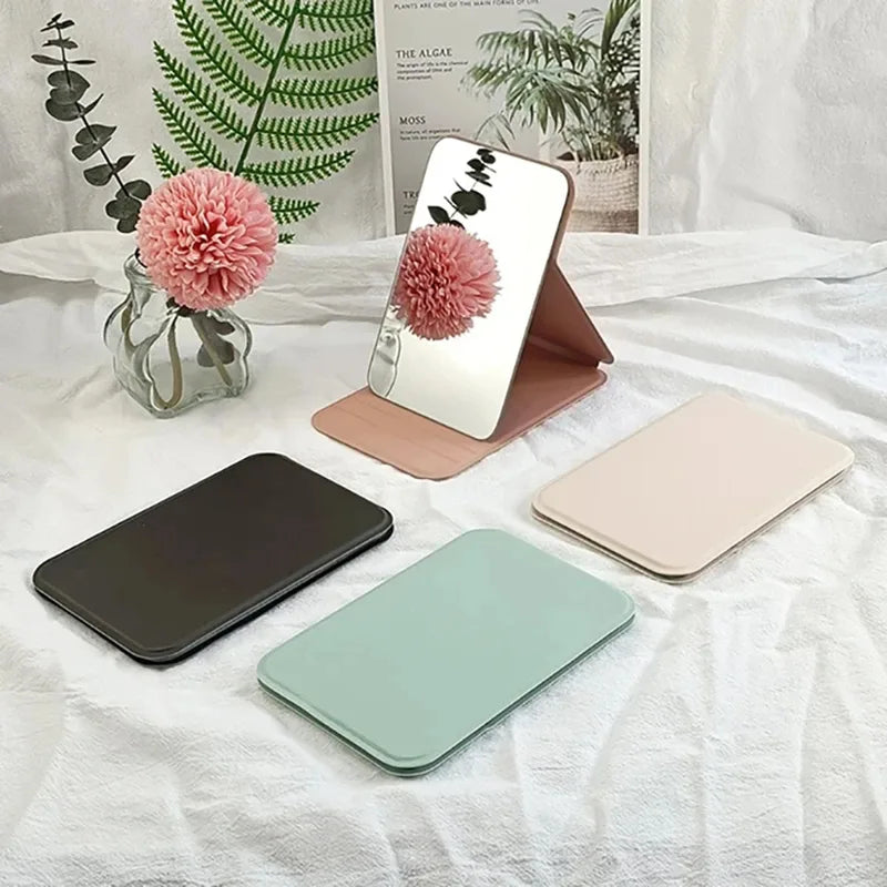 Portable Folding Makeup Mirror with Solid Color Handle - Compact and Stylish for Women