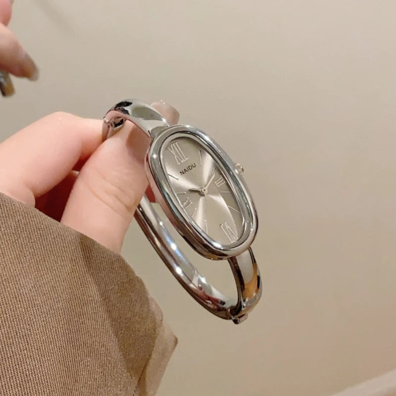 Women’s Oval Roman Dial Quartz Watch with Gold Finish and Bracelet Strap