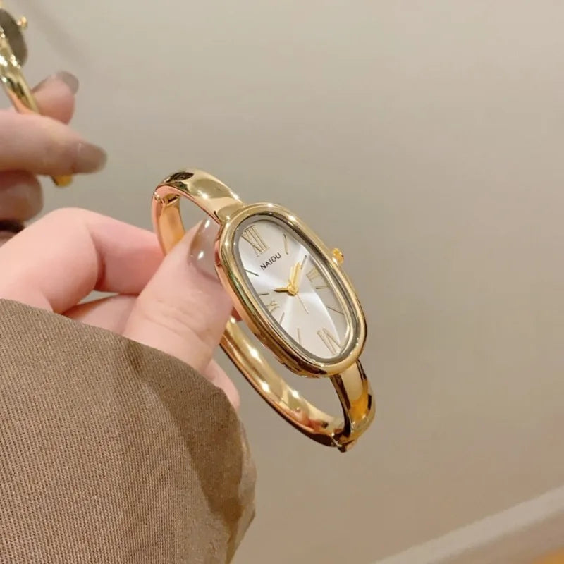 Women’s Oval Roman Dial Quartz Watch with Gold Finish and Bracelet Strap