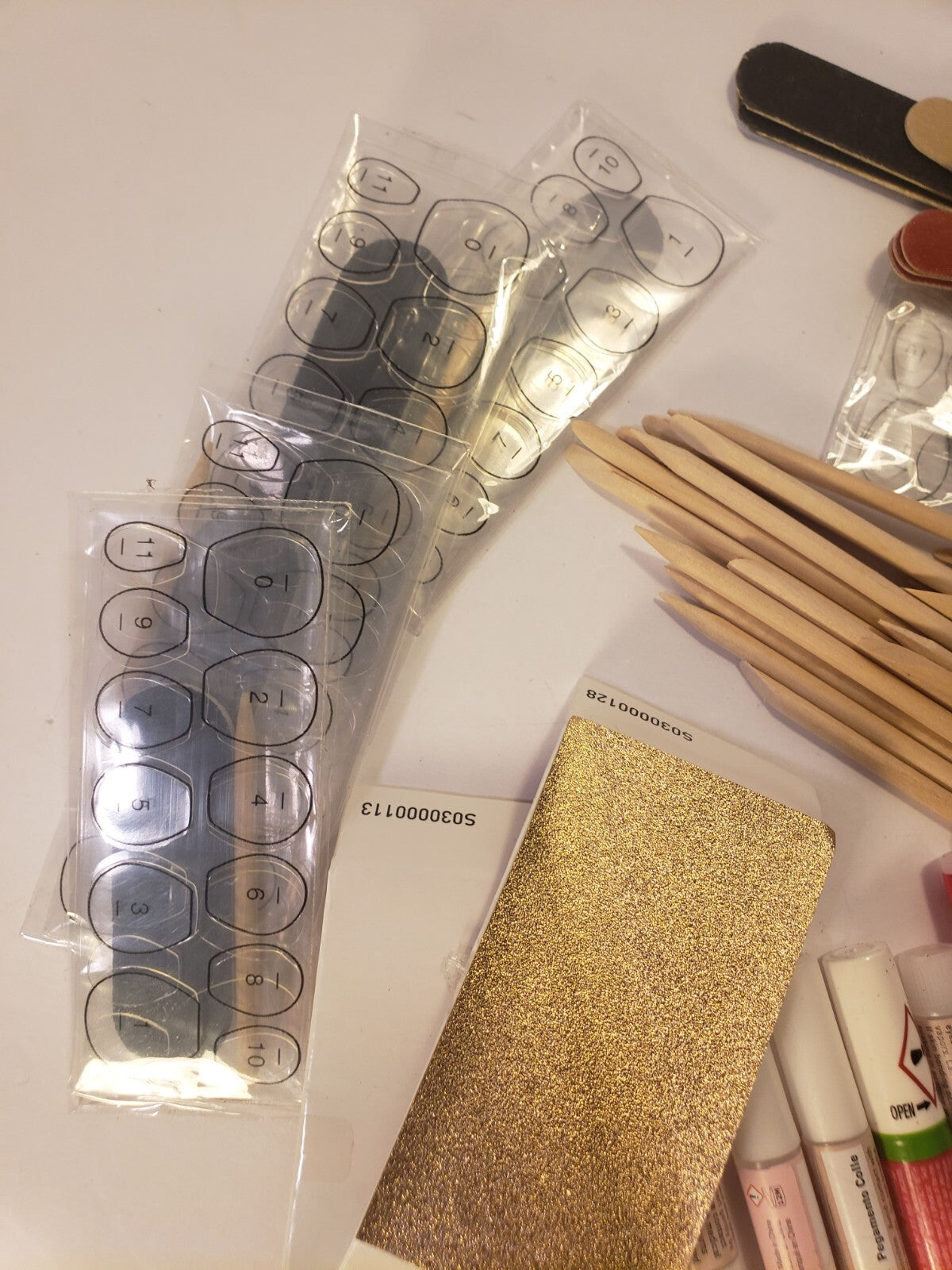 Manicure Supplies Bundle with Nail Files Clippers Glue Pads for Press-On Nails