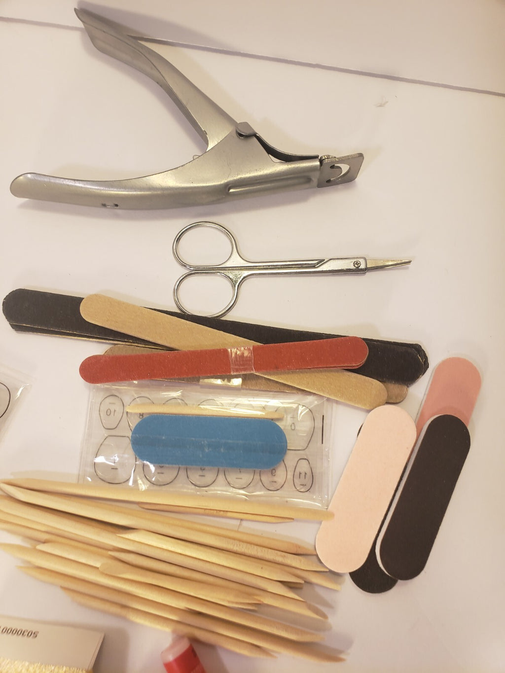 Manicure Supplies Bundle with Nail Files Clippers Glue Pads for Press-On Nails